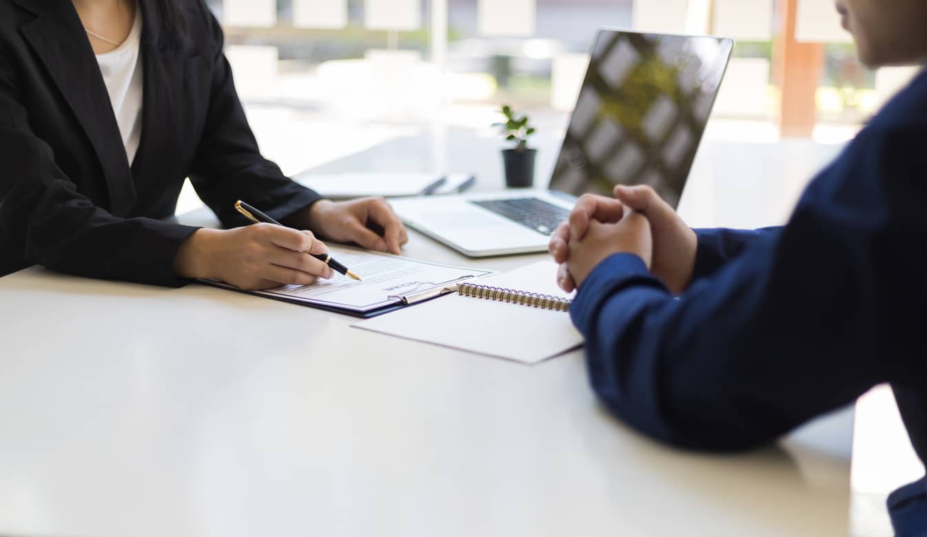 The manager is reading the resume and is interviewing the new employee. Negotiating business and signing a contract. Lawyer and legal advisor. The manager is reading the resume and is interviewing the new employee. Negotiating business and signing a contract. Lawyer and legal advisor.